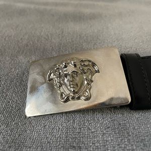 Gianni Versace men’s black leather belt with silver buckle. Size: 38 inches.